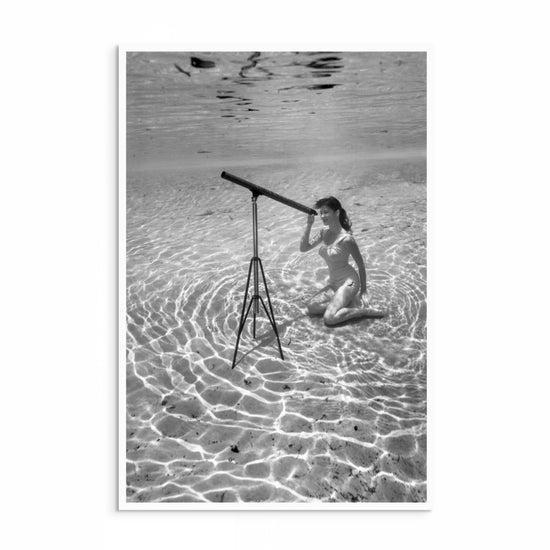 Bruce Mozert 1940s black-and-white underwater photograph of a model with a telescope