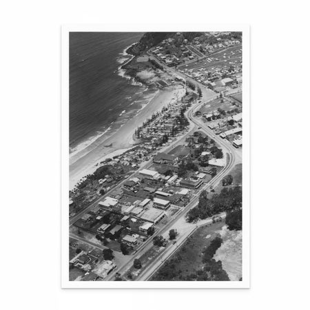 1950s aerial photograph of Burleigh Heads, QLD, in black and white, showing rooftops, coastal layout, and the iconic headland.