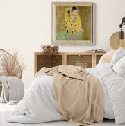 Gustav Klimt’s ‘The Kiss’ print showcasing detailed golden figures in an iconic early 20th-century artwork