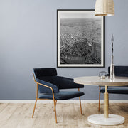 1950s black and white aerial photo of Christchurch city showing grid streets, green parks, and the bay.