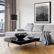 1950s black and white aerial photo of Christchurch city showing grid streets, green parks, and the bay.