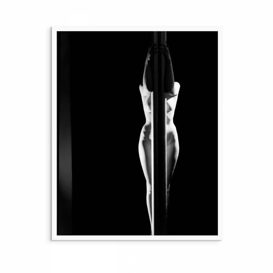 Black-and-white 1940s photo by Max Dupain showing a stylised figure with strong light contrast and artistic framing.