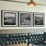 Aerial black-and-white 1950s photographs of Wellington City showing harbour, hills, coastline and urban streets.