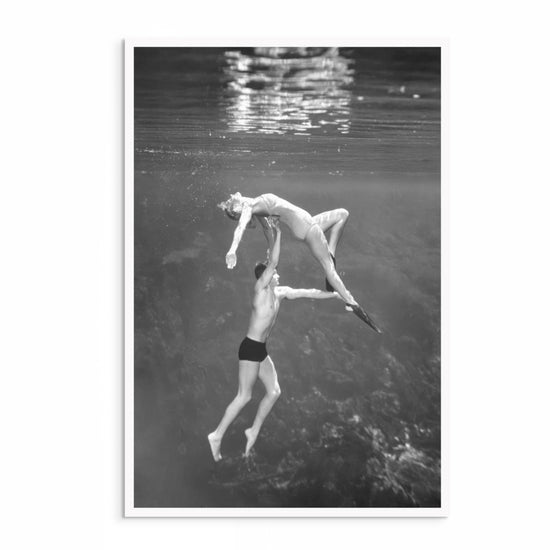 1940s vintage underwater acrobatic photography by Bruce Mozert – black and white print featuring a man and woman performing beneath the surface.